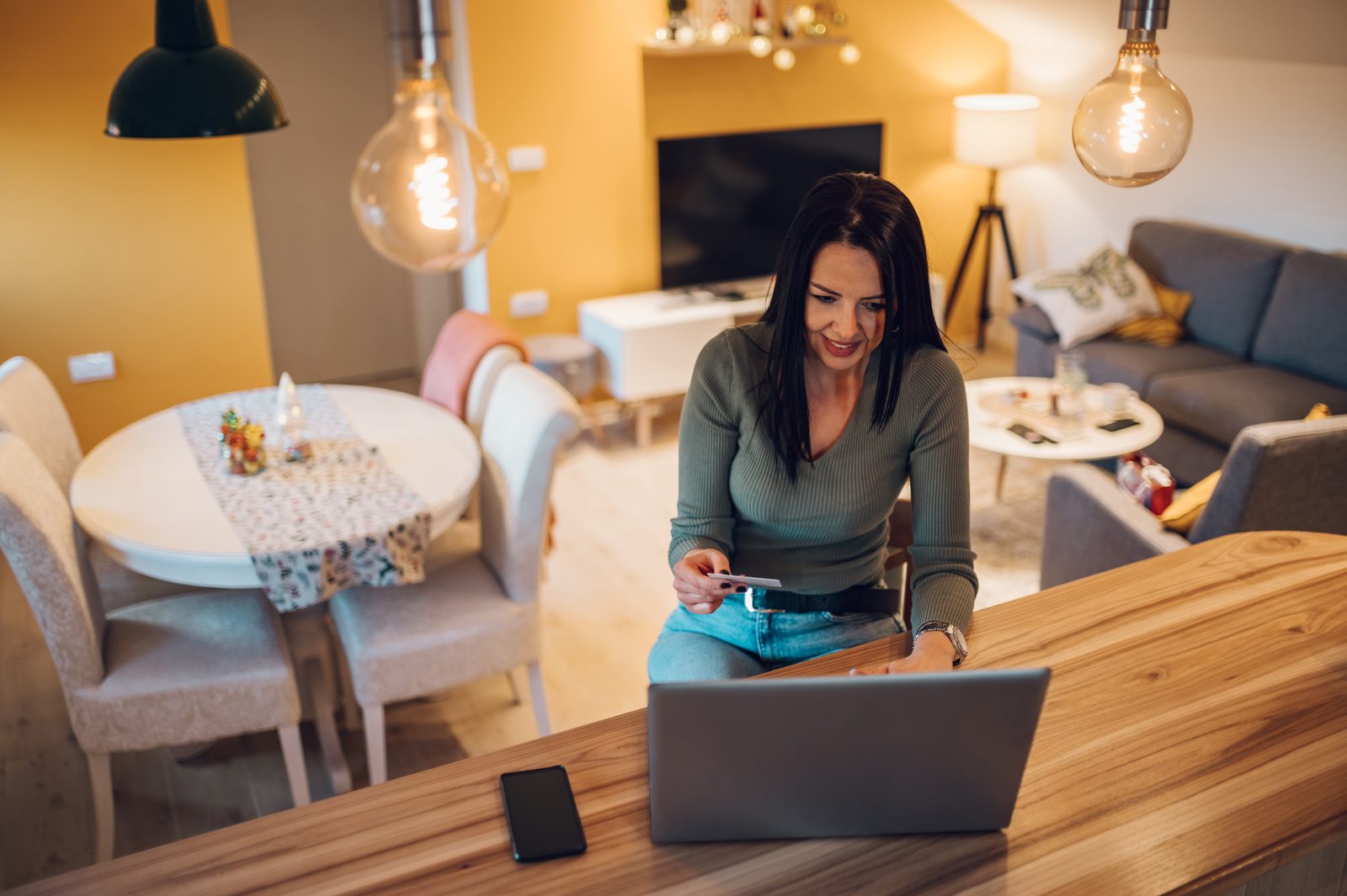 Woman reviewing her credit report and finances at home
